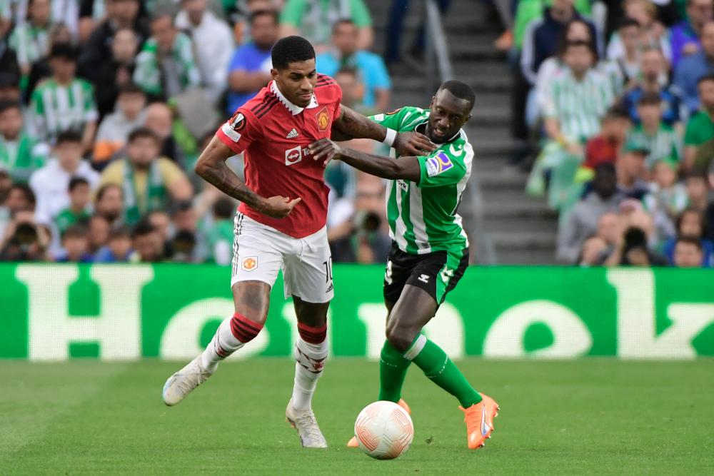 Manchester United forward Marcus Rashford (L) vies with Real Betis defender Youssouf Sabaly during the UEFA Europa League last 16 second leg football match between Real Betis and Manchester United at the Benito Villamarin stadium in Seville on March 16, 2023. AFPPIX