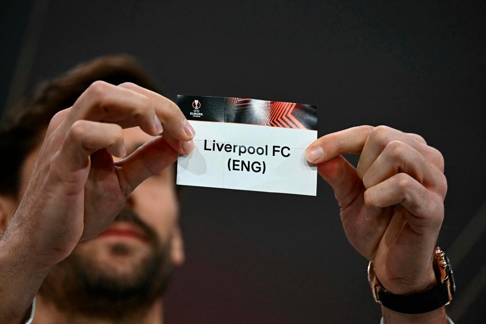 Spanish former footballer Fernando Llorente holds the paper slip of Liverpool FC during the 2023-2024 UEFA Europa League football tournament quarter-finals and semi-finals draw at the House of European Football in Nyon, on March 15, 2024/AFPPix