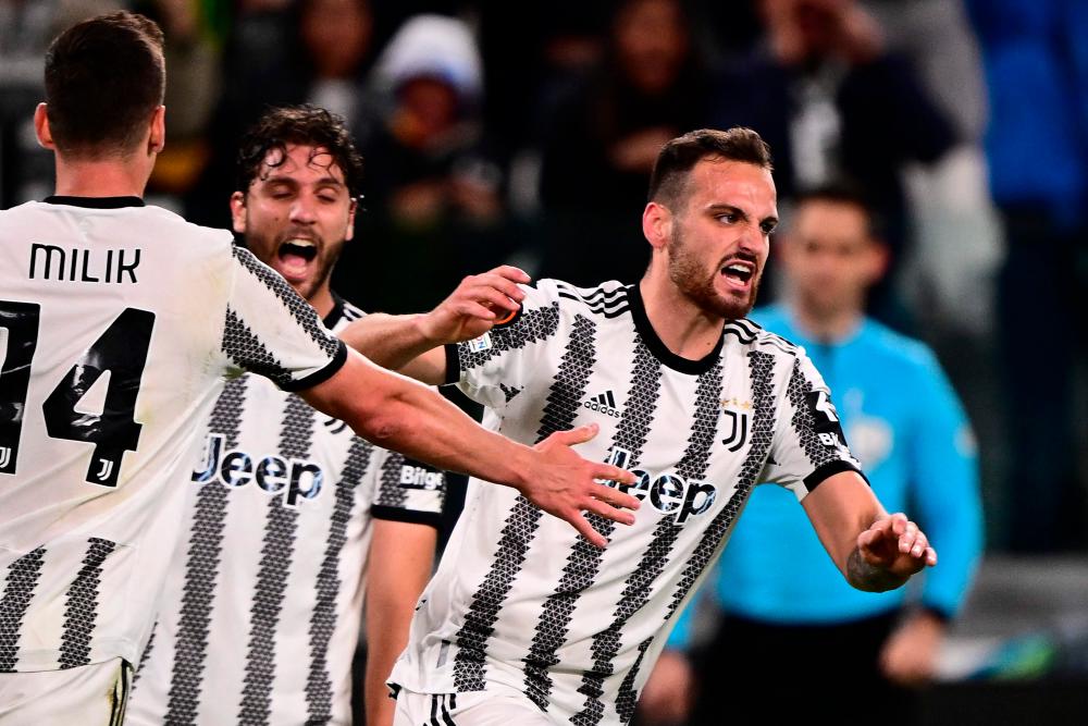 Juventus’ Italian defender Federico Gatti (R) celebrates after scoring an equalizer during the UEFA Europa League semi-final first leg football match between Juventus and Sevilla on May 11, 2023 at the Juventus stadium in Turin/AFPpix