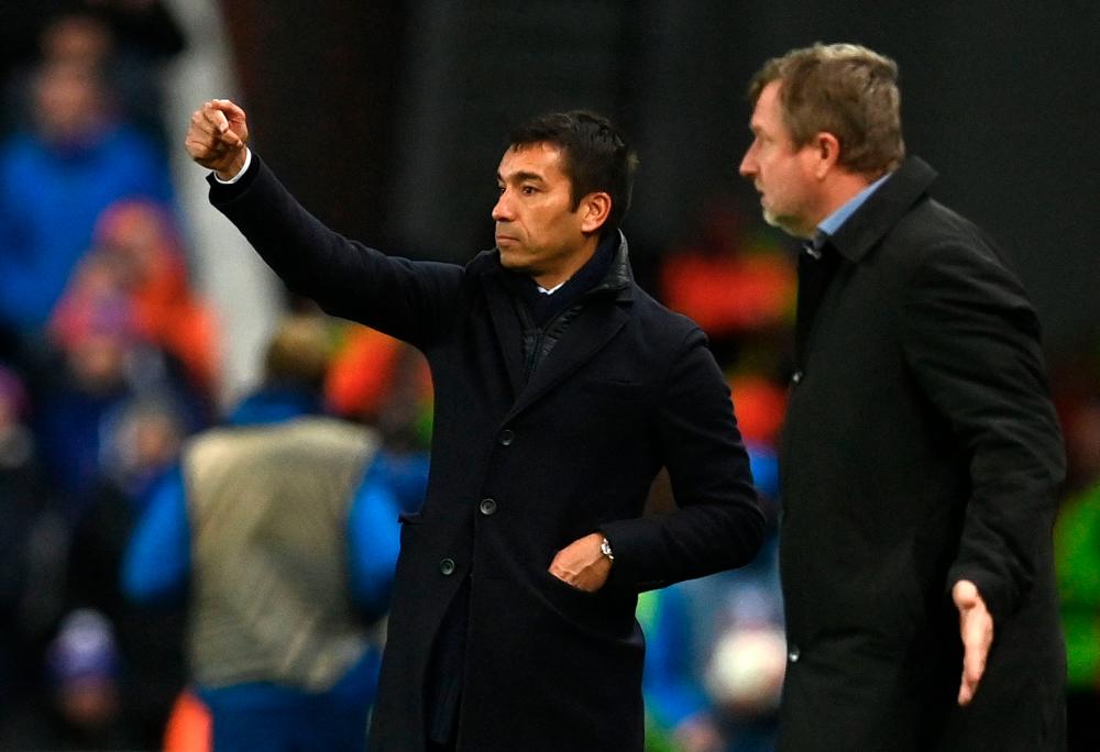 Rangers' Dutch manager Giovanni van Bronckhorst (L) and Sparta Praha's head coach Pavel Vrba watches his players from the touchline during the UEFA Europa League Group A football match between Rangers and Sparta Prague at the Ibrox Stadium in Glasgow on November 25, 2021. - AFPPIX