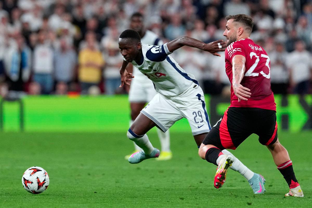 Tottenham Hotspur's Senegalese forward #29 Pape Matar Sarr and Manchester United's English defender #23 Luke Shaw vie for the ball during the UEFA Europa League final football match between Tottenham Hotspur and Manchester United at San Mames stadium in Bilbao on May 21, 2025. - AFPPIX