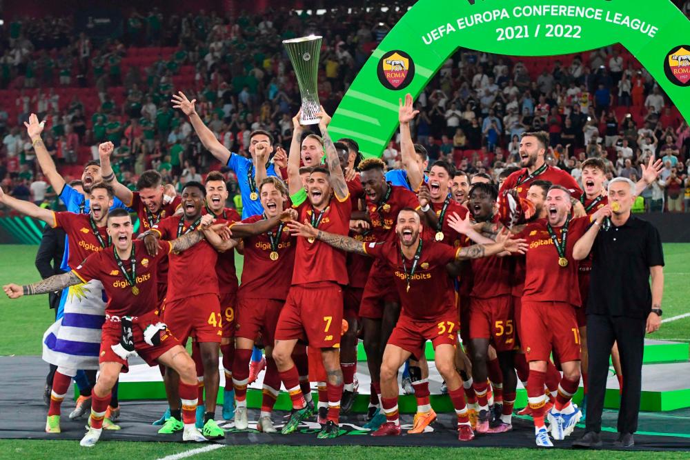 Roma's players celebrate with the trophy after winning the UEFA Europa Conference League final football match between AS Roma and Feyenoord at the Air Albania Stadium in Tirana on May 25, 2022. AFPPIX