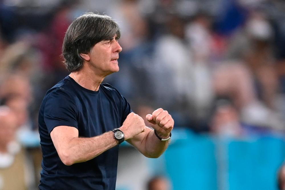 Germany’s coach Joachim Loew speaks to his players during the UEFA EURO 2020 Group F football match between France and Germany in Munich on June 15, 2021. – AFPPIX