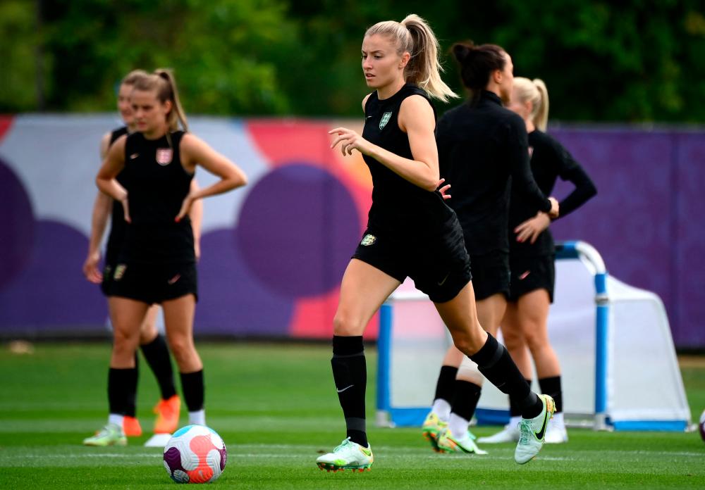 England’s defender Leah Williamson (C) controls a ball during a team training session at their training camp at the Lensbury resort in Teddington on July 30, 2022 on the eve of their UEFA Women’s Euro 2022 final football match against Germany. AFPPIX