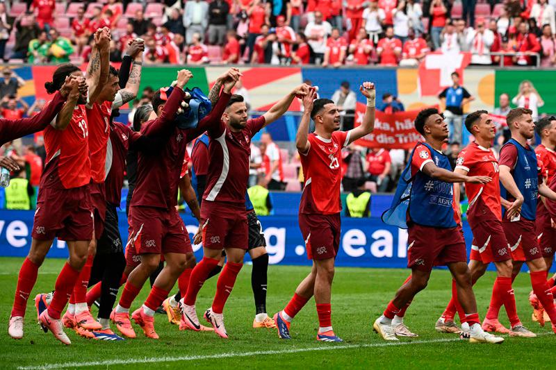 $!Switzerland's players celebrate after the UEFA Euro 2024 Group A football match between Hungary and Switzerland at the Cologne Stadium in Cologne on June 15, 2024. - AFPpix