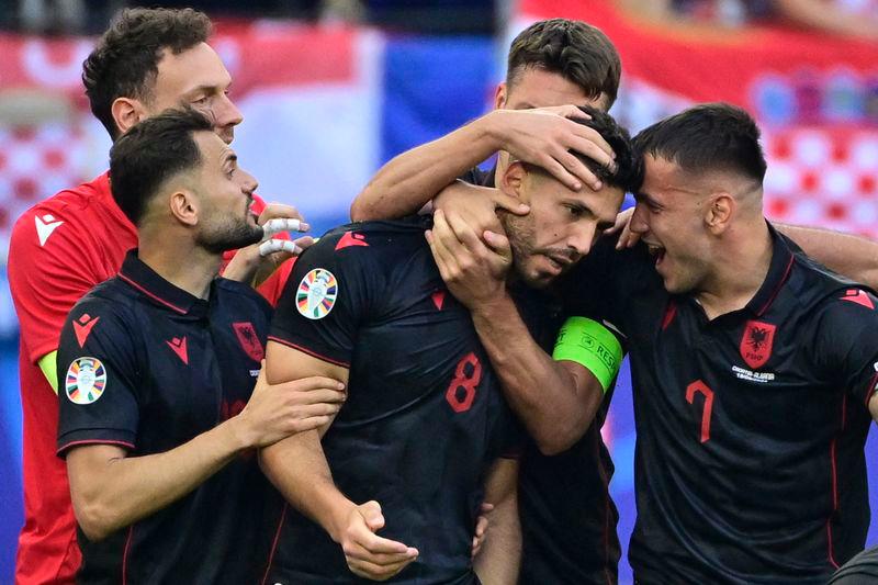 Albania's midfielder Klaus Gjasula celebrates with his team mates after scoring the equalising goal 2:2 during the UEFA Euro 2024 Group B football match between Croatia and Albania - AFPpix