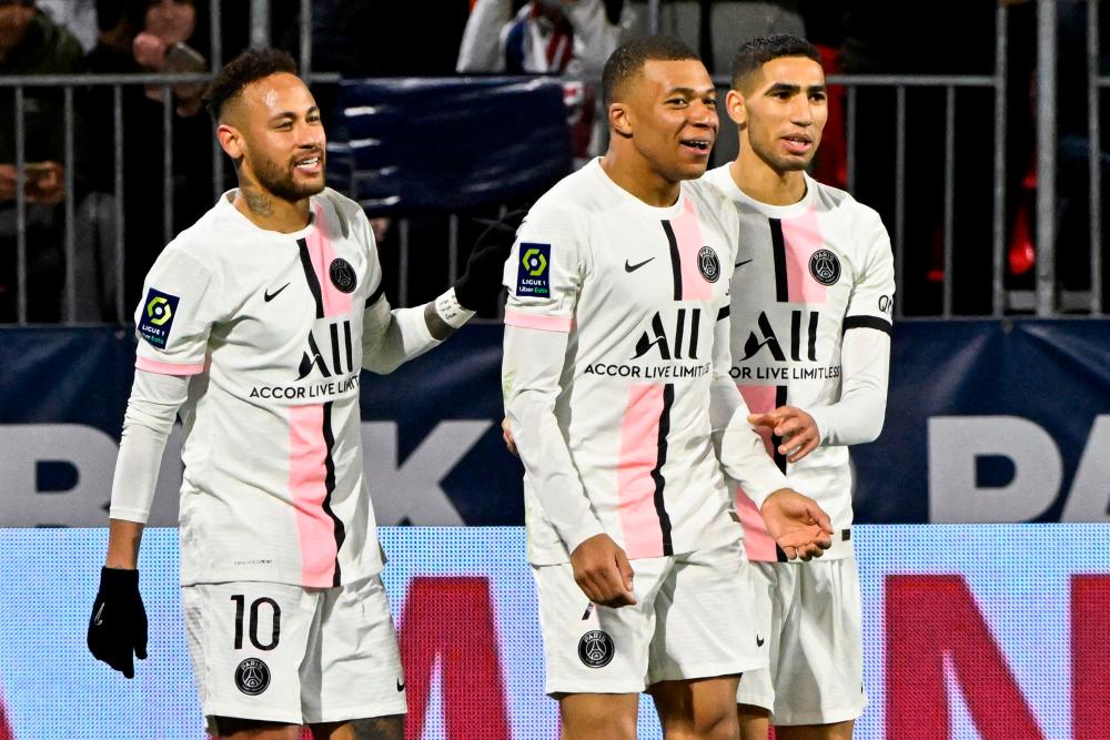 (From L) Paris Saint-Germain’s Brazilian forward Neymar, Paris Saint-Germain’s French forward Kylian Mbappe and Paris Saint-Germain’s Moroccan defender Achraf Hakimi react during the French L1 football match between Clermont Foot 63 and Paris Saint-Germain (PSG) at the Gabriel-Montpied stadium in Clermont-Ferrand, central France, on April 9, 2022. AFPPIX