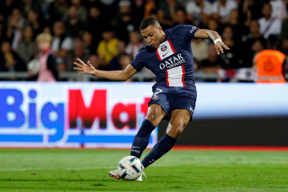 Paris Saint-Germain’s French forward Kylian Mbappe shoots to score a goal during the French L1 football match between AC Ajaccio and Paris Saint-Germain (PSG) at the Francois Coty Stadium in Ajaccio, Corsica, on October 21, 2022. AFPPIX