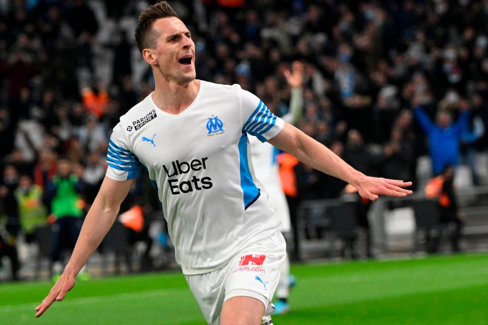 Marseille’s Polish forward Arkadiusz Milik celebrates scoring his team’s fourth goal during the French L1 football match between Olympique Marseille (OM) and SCO Angers. AFPPIX