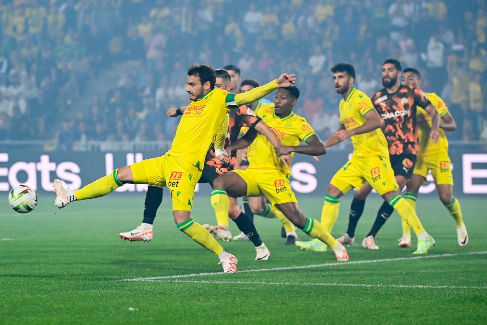 Nantes' Spanish midfielder #05 Pedro Chirivella kicks the ball during the French L1 football match between FC Nantes and Marseille at the Stade de la Beaujoire–Louis Fonteneau in Nantes, western France on September 1, 2023. AFPPIX
