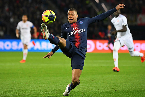 Paris Saint-Germain’s French forward Kylian Mbappe controls the ball during the French L1 football match between Paris Saint-Germain (PSG) and Dijon at the Parc des Princes stadium in Paris on May 18, 2019. - AFP