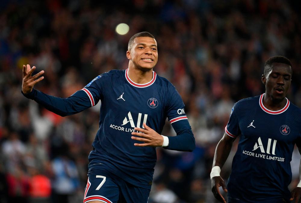 (FILES) Paris Saint-Germain's French forward Kylian Mbappe celebrates scoring his team's second goal during the French L1 football match between Paris-Saint Germain (PSG) and Olympique Marseille (OM) at The Parc des Princes Stadium in Paris on April 17, 2022. AFPPIX