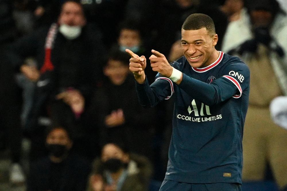 Paris Saint-Germain's French forward Kylian Mbappe celebrates after scoring a goal during the French L1 football match between Paris Saint-Germain (PSG) and AS Monaco (ASM) at the Parc des Princes stadium in Paris, on December 12, 2021. AFPpix
