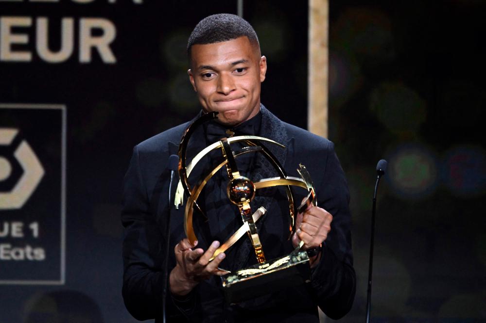 Paris Saint-Germain’s French forward Kylian Mbappe reacts after receiving the Best Ligue 1 Player award during the 31th edition of the UNFP (French National Professional Football players Union) trophy ceremony, in Paris May 28, 2023/AFPPix