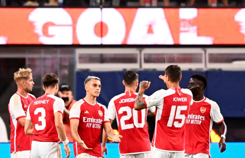 Arsenal’s Belgian midfielder Leandro Trossard (3L) celebrates scoring his team’s fourth goal during a pre-season friendly football match between Arsenal FC and FC Barcelona at SoFi Stadium in Inglewood, California, on July 26, 2023. AFPPIX