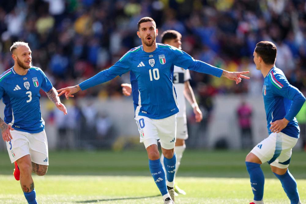 Italy's forward #10 Lorenzo Pellegrini celebrates after scoring his team's first goal during the international friendly football match between Italy and Ecuador at Red Bull Arena in Harrison, New Jersey, on March 24, 2024. - AFPPIX