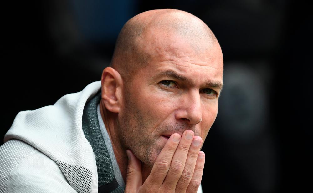 Madrid’s French head coach Zinedine Zidane attends the Audi Cup football match for third place between Real Madrid and Fenerbahce in Munich, on July 31, 2019. — AFP