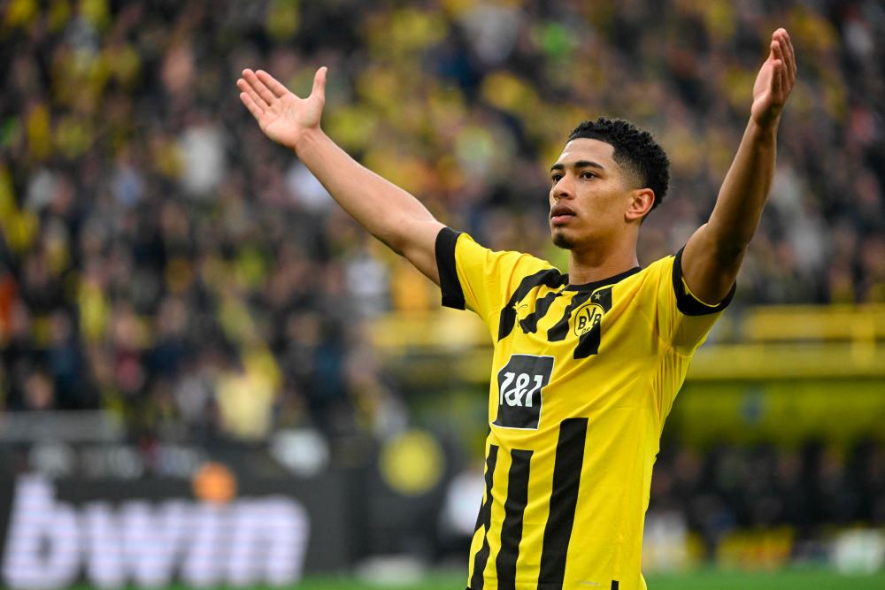 Dortmund’s English midfielder Jude Bellingham celebrates scoring his team’s first goal during the German first division Bundesliga football match between BVB Borussia Dortmund and Eintracht Frankfurt in Dortmund, western Germany, on April 22, 2023/AFPPix