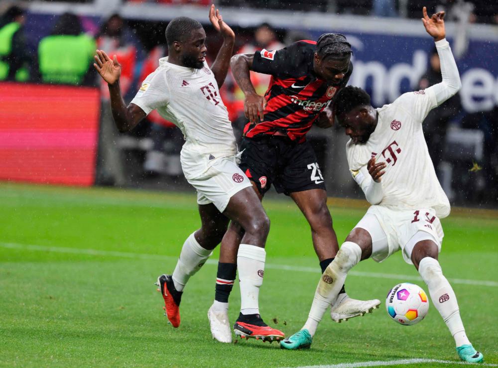 Frankfurt’s French midfielder #26 Eric Ebimbe (C) scores his team’s second goal during the German first division Bundesliga football match between Eintracht Frankfurt and FC Bayern Munich in Frankfurt, western Germany on December 9, 2023/AFPPix