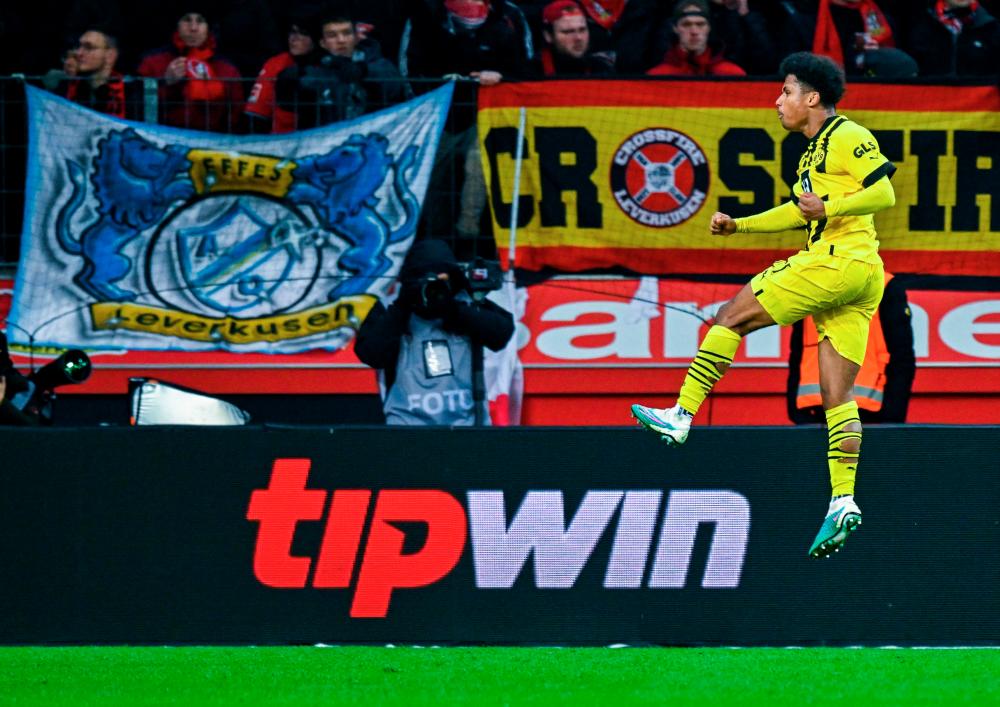 Dortmund's Karim Adeyemi celebrates scoring during the German first division Bundesliga football match between Bayer 04 Leverkusen and Borussia Dortmund in Leverkusen, western Germany on January 29, 2023. AFPPIX