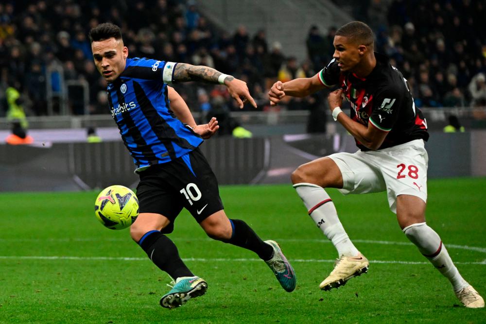 Inter Milan’s Argentinian forward Lautaro Martinez outruns AC Milan’s German-Finnish defender Malick Thiaw (R) during the Italian Serie A football match between Inter and AC Milan on February 5, 2023 at the San Siro stadium in Milan/AFPPix