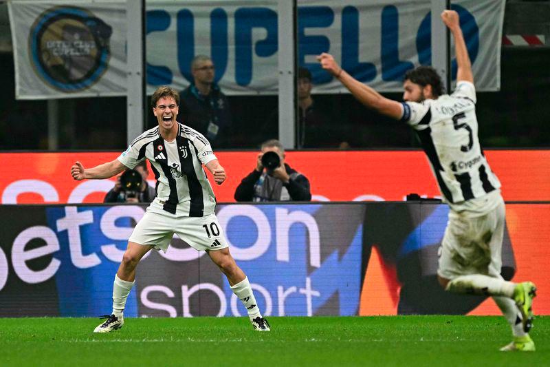 Juventus' midfielder #10 Kenan Yildiz celebrates scoring his team's fourth goal during the Italian Serie A football match between Inter Milan and Juventus at San Siro stadium in Milan, on October 27, 2024. - AFPPIX