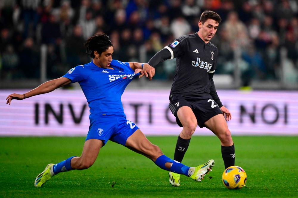Empoli’s Italian midfielder #29 Youssef Maleh (L) fights for the ball with Juventus’ Italian defender #27 Andrea Cambiaso during the Italian Serie A football match between Juventus and Empoli, at The Allianz Stadium, in Turin on January 27, 2024/AFPPix