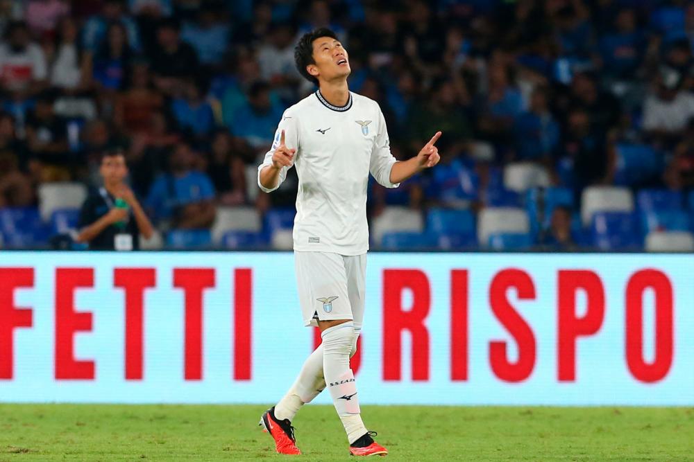 Lazio's Japanese midfielder #06 Daichi Kamada celebrates after scoring the team's second goal during the Italian Serie A football match SSC Napoli vs SS Lazio at the Diego Armando Maradona Stadium in Naples, on September 2, 2023. - AFPPIX