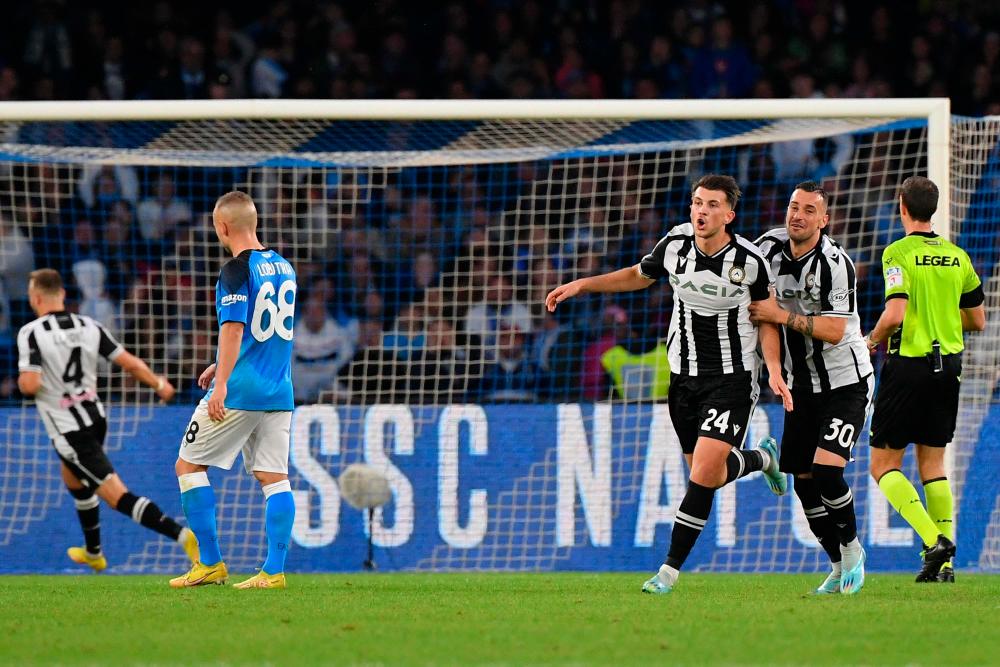 Udinese’s German midfielder Lazar Samardzic (3rdR) celebrates after scoring his side’s second goal during the Italian Serie A football match between Napoli and Udinese/AFPPix