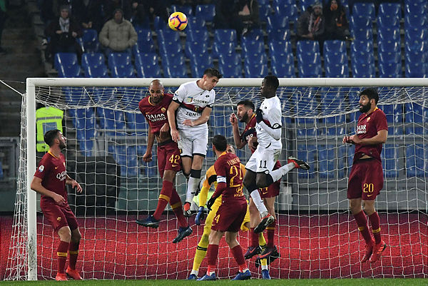 Genoa’s Polish forward Krzysztof Piatek (C-L) and AS Roma French midfielder Steven Nzonzi (2ndL) go for a header during the Italian Serie A football match AS Roma vs Genoa on Dec 16, 2018 at the Olympic stadium in Rome. — AFP