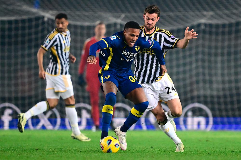 Juventus’ Italian defender #24 Daniele Rugani fights for the ball with Hellas Verona’s Italian midfielder #90 Michael Folorunsho (C) during the Italian Serie A football match between Hellas Verona and Juventus at the Marcantonio Bentegodi stadium in Verona on February 17, 2024/AFPPix