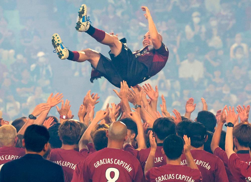 Vissel Kobe’s Andres Iniesta is tossed up during his farewell ceremony following the J-League football match between Vissel Kobe and Hokkaido Consadole Sapporo in Kobe on July 1, AFPPIX