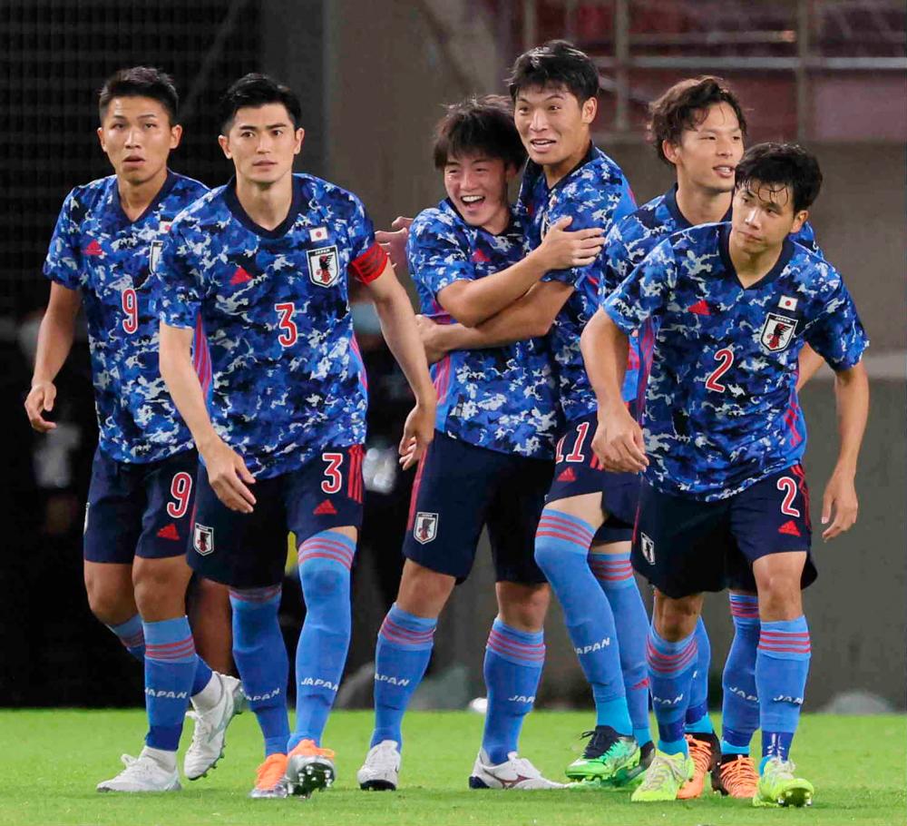 Japan’s forward Yuki Soma (C) celebrates his goal with teammates during their football match between Japan and Hong Kong at the EAFF (East Asian Football Federation) E-1 Football Championship in Kashima, Ibaraki prefecture on July 19, 2022. AFPPIX
