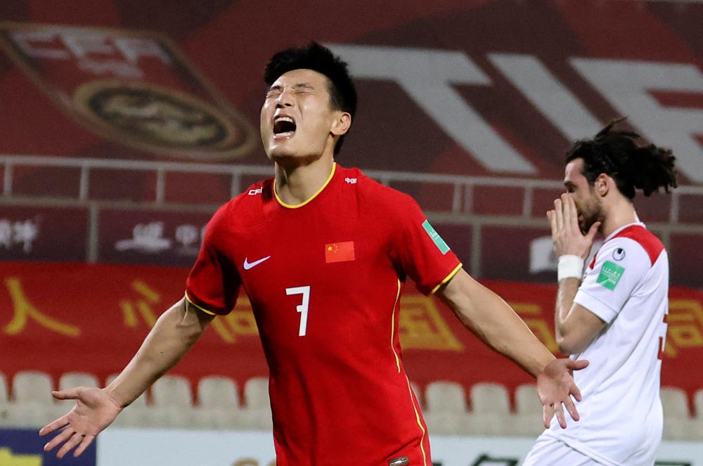 China’s WU Lei celebrates after scoring during the 2022 FIFA World Cup qualification group A match against Syria at the Sharjah Football Stadium in Sharjah on June 15, 2021. – AFPPIX