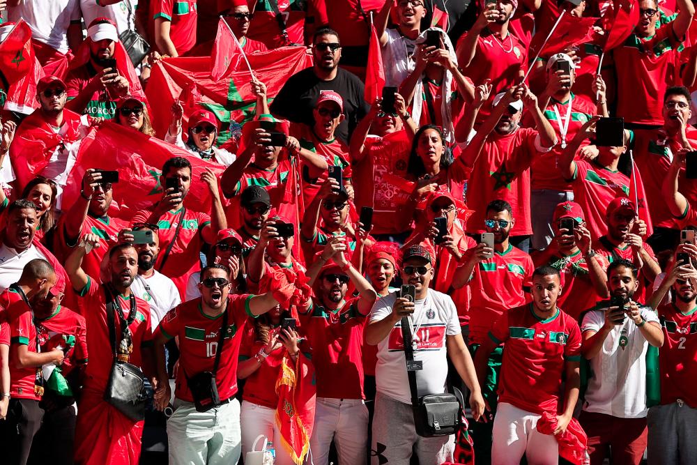 Fans of Morocco cheer on the stands ahead of the Qatar 2022 World Cup Group F football match between Morocco and Croatia at the Al-Bayt Stadium in Al Khor, north of Doha on November 23, 2022. - AFPPIX