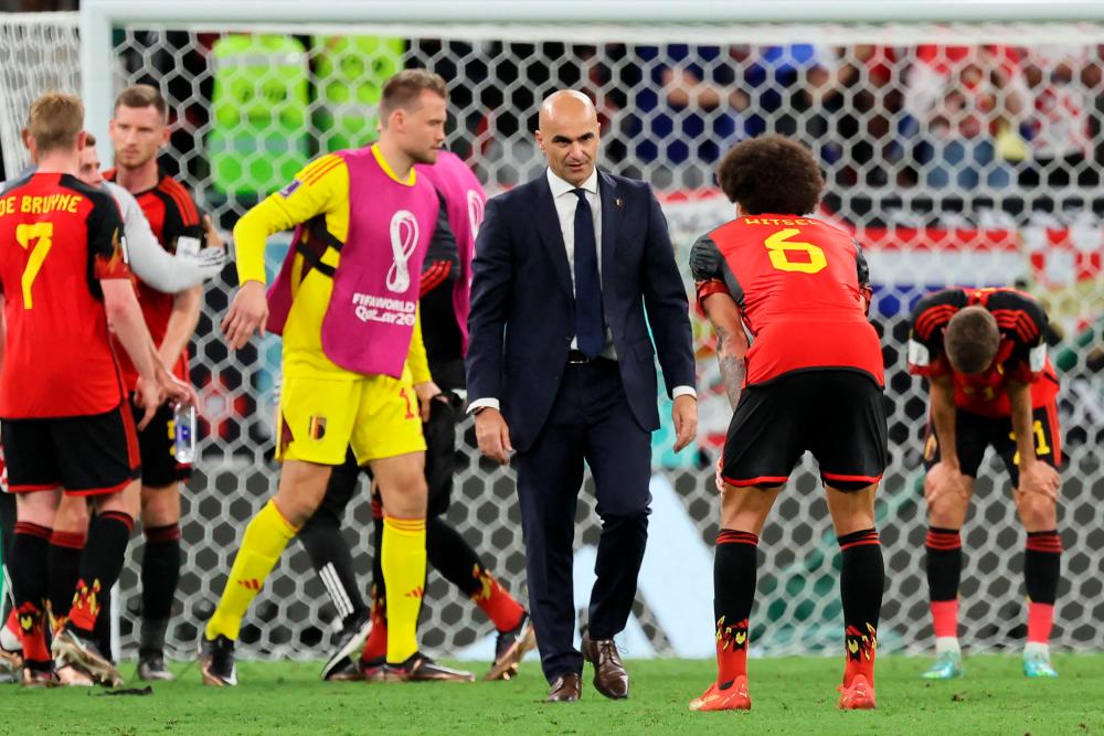 Belgium’s Spanish coach #00 Roberto Martinez checks on his team after the Qatar 2022 World Cup Group F football match between Croatia and Belgium at the Ahmad Bin Ali Stadium in Al-Rayyan, west of Doha on December 1, 2022. AFPPIX