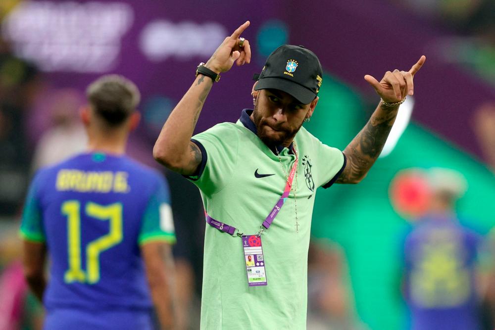 Brazil's forward #10 Neymar celebrates at the end of the Qatar 2022 World Cup Group G football match between Cameroon and Brazil at the Lusail Stadium in Lusail, north of Doha on December 2, 2022. Brazil's is qualified for the round of 16 even after loosing against Cameroon 0 - 1. - AFPPIX