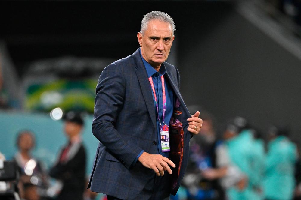 Brazil’s coach #00 Tite watches his players from the touchline during the Qatar 2022 World Cup quarter-final football match between Croatia and Brazil at Education City Stadium in Al-Rayyan, west of Doha, on December 9, 2022/AFPPix