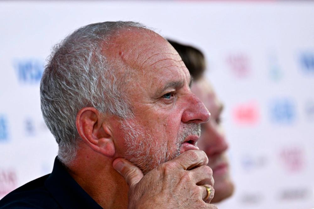 Australia’s coach #00 Graham Arnold (L) and Australia’s defender #19 Harry Souttar attend a press conference at the Qatar National Convention Center (QNCC) in Doha on December 2, 2022, on the eve of the Qatar 2022 World Cup football match between Argentina and Australia/AFPPix