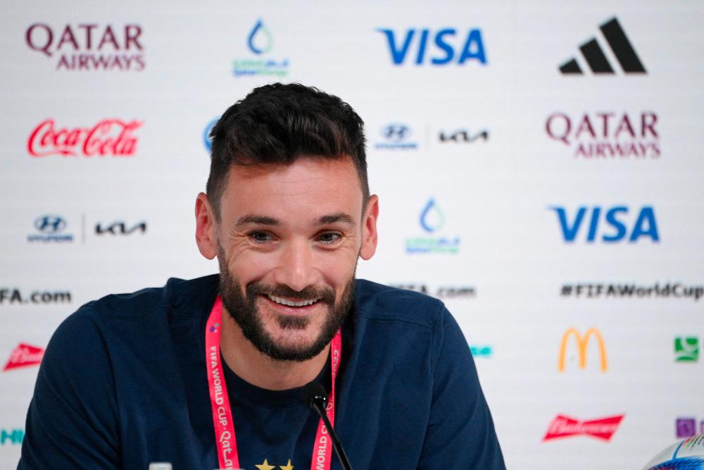 France's goalkeeper #01 Hugo Lloris attends a press conference at the Qatar National Convention Center (QNCC) in Doha on December 3, 2022, on the eve of the Qatar 2022 World Cup Round of 16 football match between France and Poland. - AFPPIX