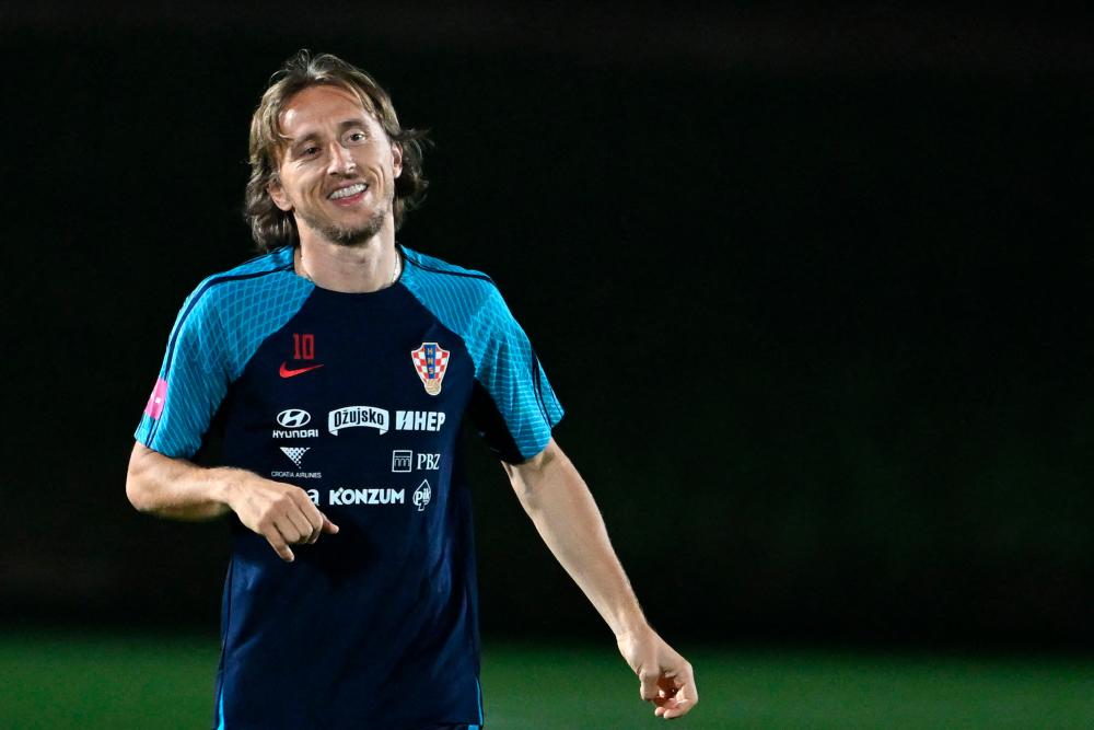 Croatia’s midfielder #10 Luka Modric takes part in a training session with teammates at the team’s Al Erssal training camp in Doha on December 3, 2022, during the Qatar 2022 World Cup football tournament/AFPPix