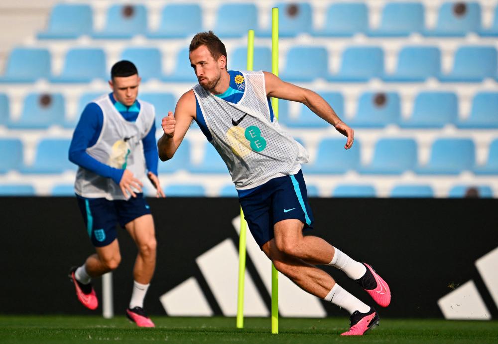 England’s forward Harry Kane takes part in a training session at the Al Wakrah SC Stadium in Al Wakrah, south of Doha, on December 7, 2022, during the Qatar 2022 World Cup football tournament. England and France will meet in one of the Qatar 2022 World Cup quarter-finals on December 10. AFPPIX