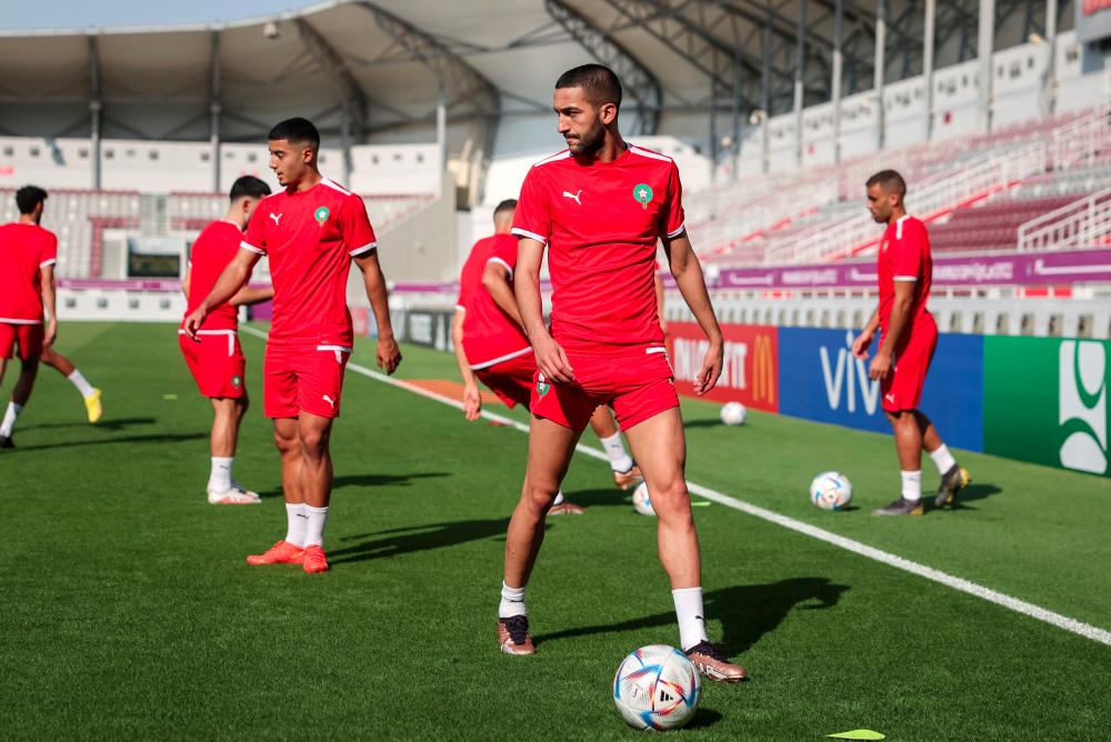 Morocco's midfielder Hakim Ziyech takes part in a training session at the Al Duhail SC Stadium in Doha on November 22, 2022, on the eve of the Qatar 2022 World Cup football tournament Group F match between Morocco and Croatia. - AFPPIX