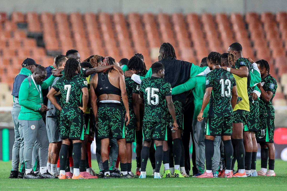 Nigeria’s players gather in a huddle after the FIFA World Cup 2026 Africa qualifiers group C match between Lesotho and Nigeria at the Peter Mokaba Stadium in Polokwane on October 10, 2025. - PHILL MAGAKOE / AFP