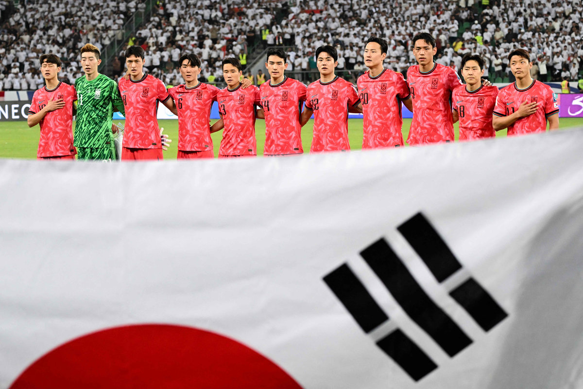 South Korea’s players stand for their national anthem ahead of the 2026 FIFA World Cup Asian Qualifier football match between Iraq and South Korea at Basra International Stadium in Basra on June 5, 2025. - AFPpix