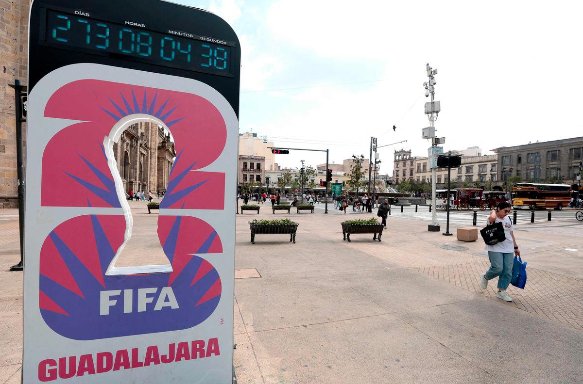 A woman walks past the FIFA World Cup 2026 countdown clock in Guadalajara, Jalisco state, Mexico on September 10, 2025. Registration is now open to participate in the ticket lottery for the 2026 FIFA World Cup, which will be held in Mexico, the United States, and Canada, with the opening match taking place at the Azteca Stadium in Mexico City on June 11, 2026. - AFPPIX