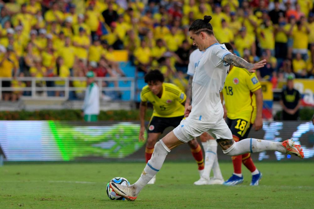 Uruguay's forward Darwin Nunez takes a penalty to score his team's second goal during the 2026 FIFA World Cup South American qualification football match between Colombia and Uruguay at the Roberto Melendez Metropolitan Stadium in Barranquilla, Colombia, on October 12, 2023. AFPPIX