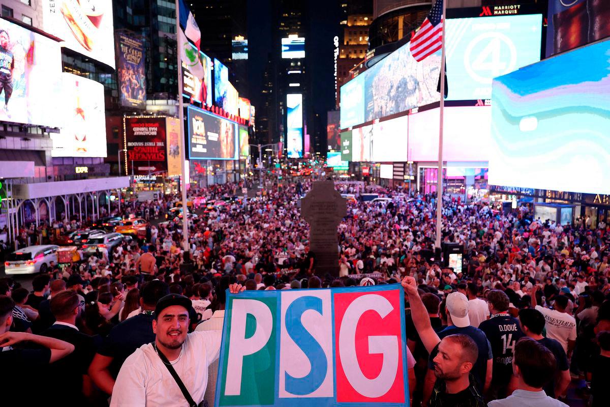 Paris Saint-Germain fans gather at Times Square in New York on July 11, 2025, ahead of the FIFA Club World Cup 2025 final football match between England’s Chelsea and France’s Paris Saint-Germain on July 13. Photo by FRANCK FIFE / AFP
