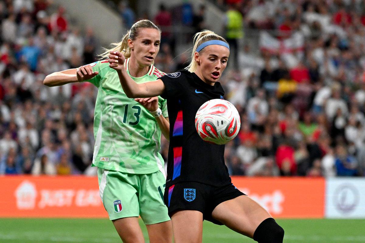 Italy's defender #13 Julie Piga (L) vies with England's forward #18 Chloe Kelly (R) during the UEFA Women's Euro 2025 semi-final football match between England and Italy at the Stade de Geneve in Geneva, on July 22, 2025. - AFPPIX