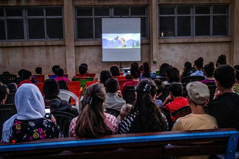 Filmmaker Shero Hinde is taking a mobile cinema around remote villages in rural northeastern Syria to share the magic of the movies with children. — AFP